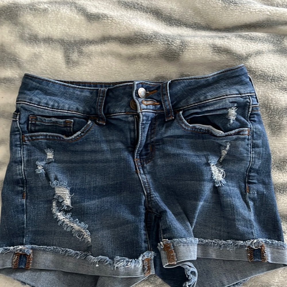 I am selling dark blue jean shorts. They are in great shape.